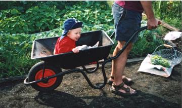 kid in wheelbarrow